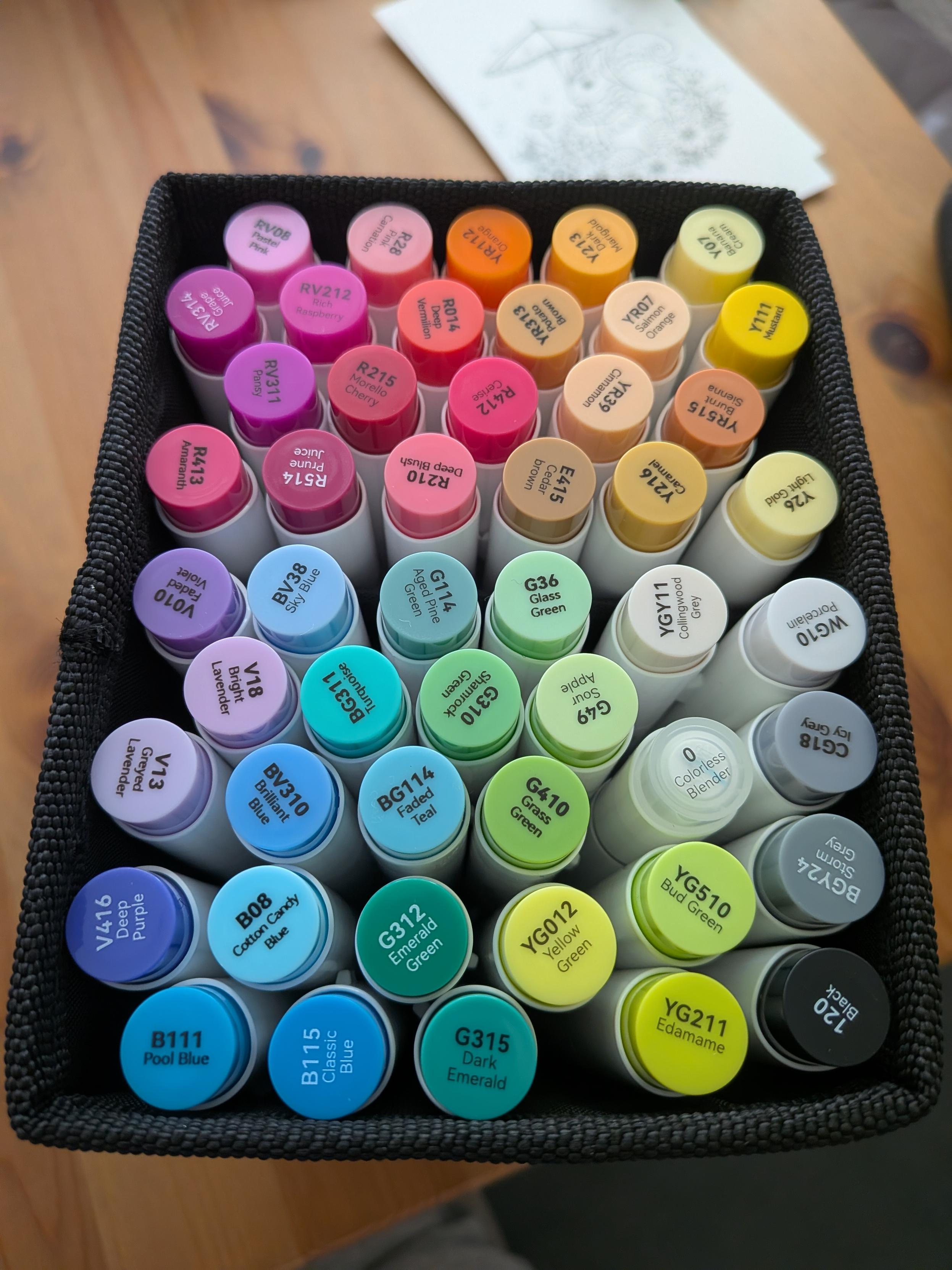The same container with markers arranged by colour.