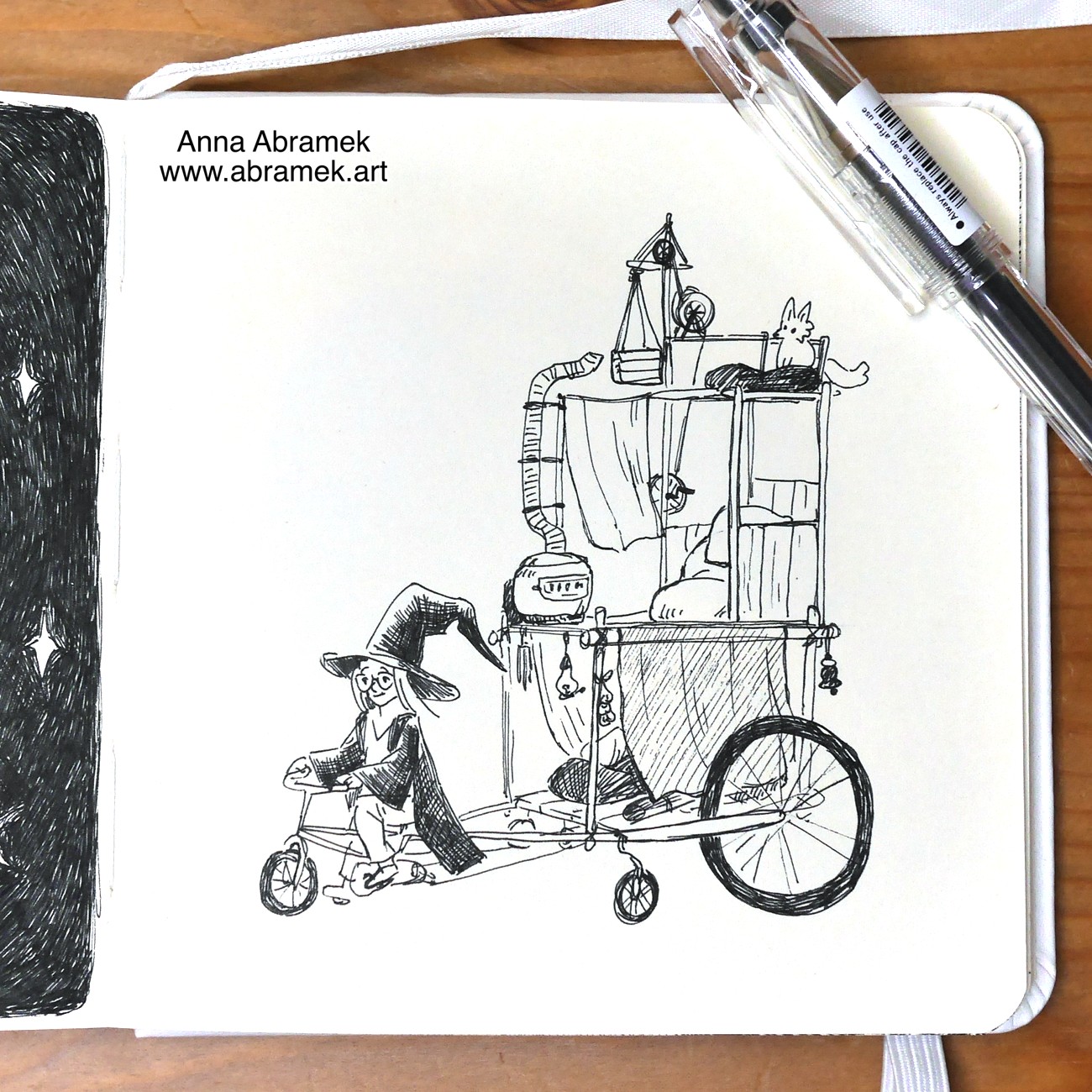 A pen drawing of a witch riding a five wheeled bike with a tower-like caravan at the back. The tower has a storage compartment, a sleeping area and a separate floor for a pet fox.